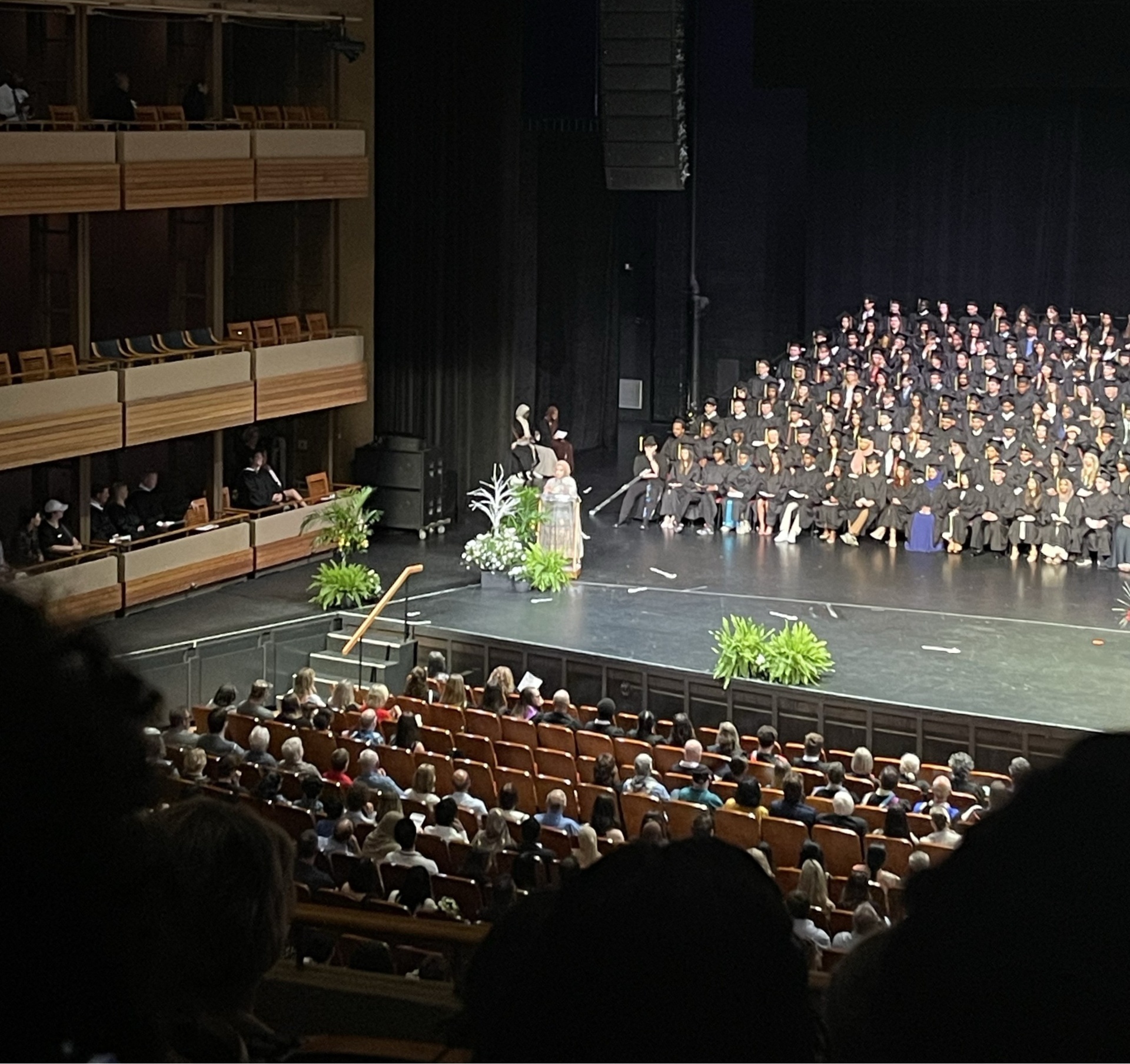 Meena speaking at a graduation ceremony